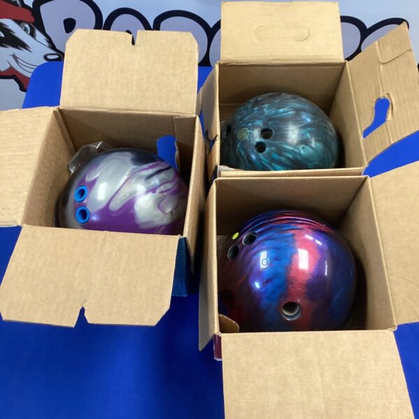 Lot of three used Brunswick and Hammer bowling balls.