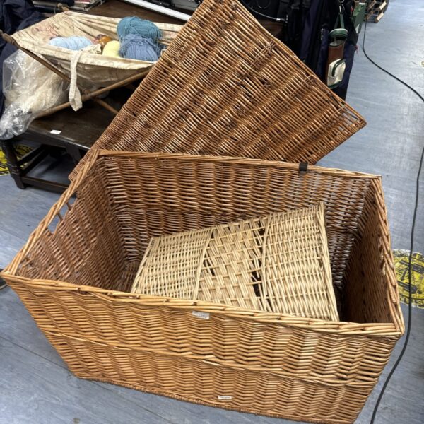 Large wicker storage basket for laundry and home storage.