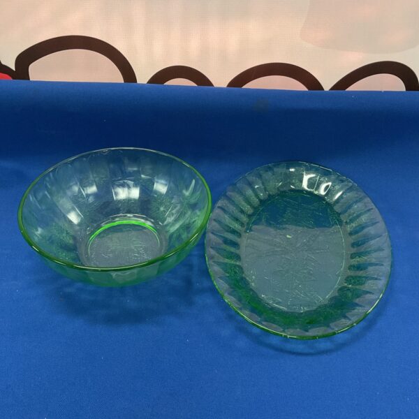Two vintage green uranium glass bowls with floral design.