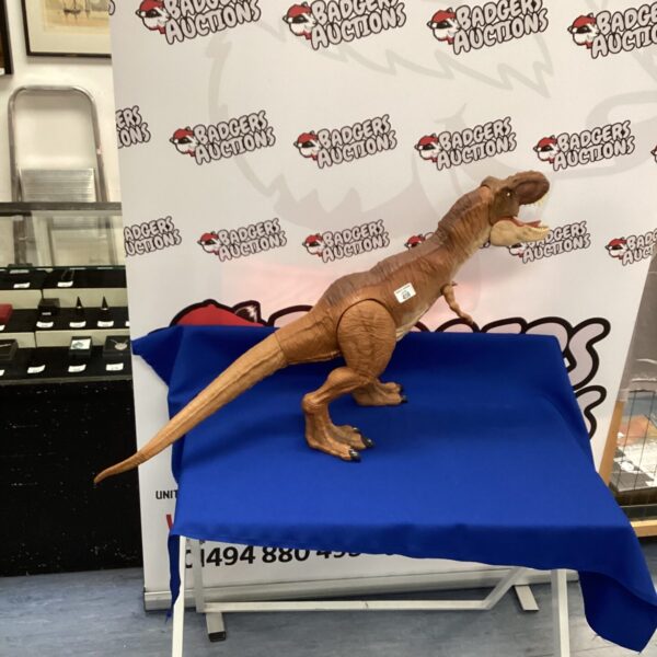 Large Jurassic World T Rex toy, detailed dinosaur figure.