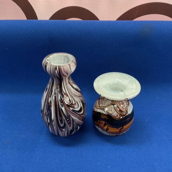 Pair of miniature art glass vases with swirl design.