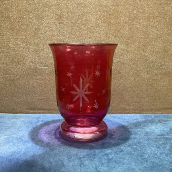 Vintage ruby glass vase with etched floral design.