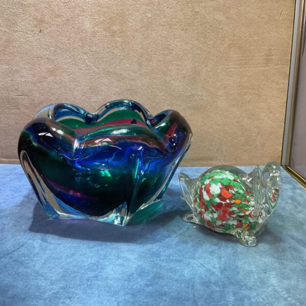 Vibrant art glass key dish and multicoloured tortoise figurine.