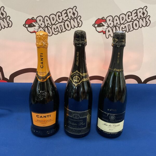 Champagne and Prosecco lot featuring Philippe Prie and Canti bottles.