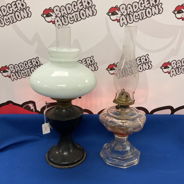 Antique paraffin oil lamp with clear glass shade.