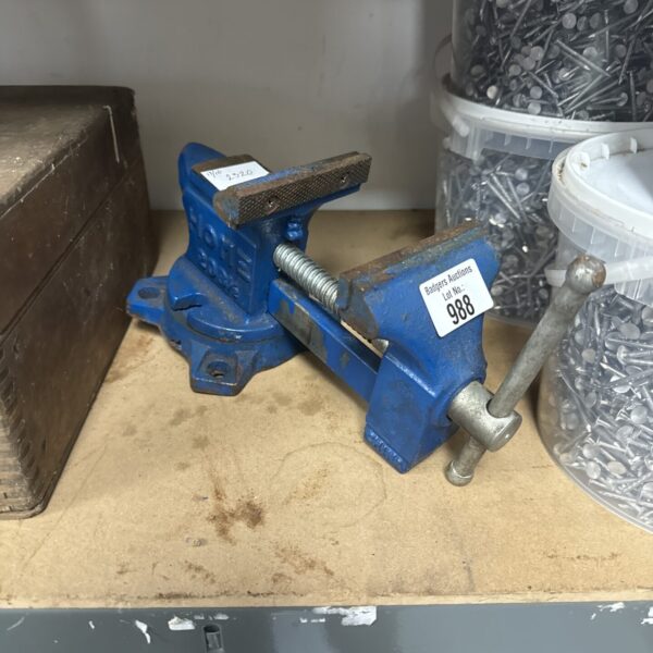 Small metal bench vice marked 2520 for workshop use.