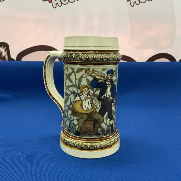 Vintage Villeroy & Boch Mettlach tankard with musician design.