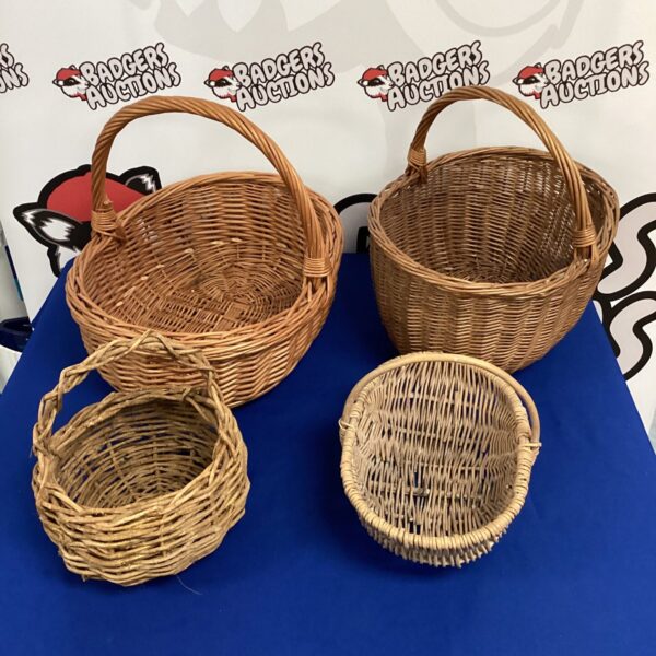 Assorted vintage wicker baskets and trugs for farmhouse decor.