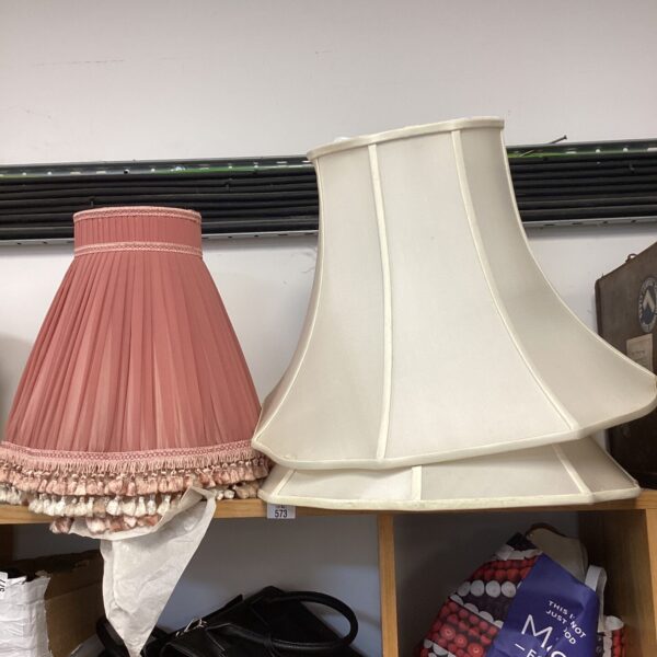 Lot of five vintage pink lamp shades with fringed edges.
