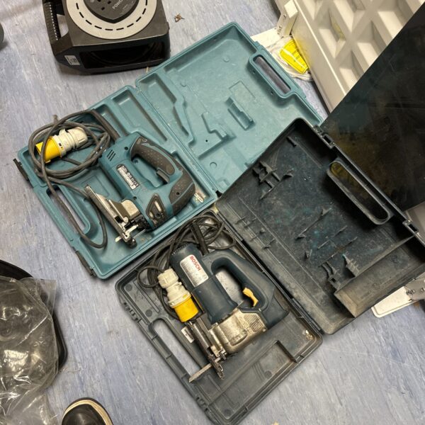 Vintage Bosch and Makita jigsaws in a carry case.
