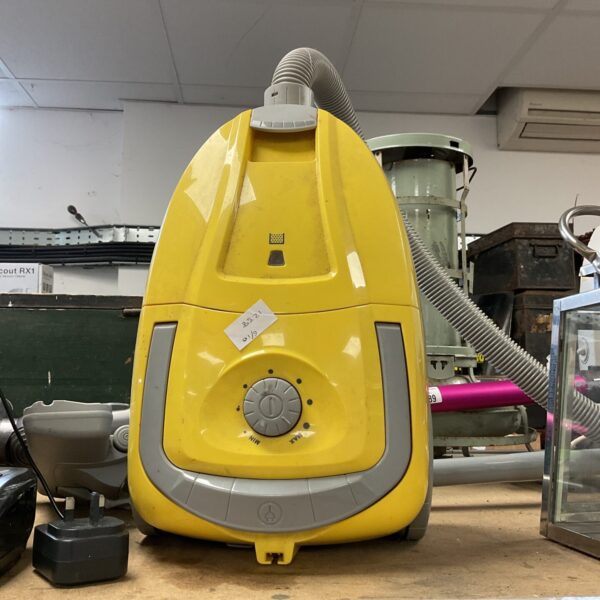 Bright yellow Argos cylinder vacuum cleaner for household cleaning.