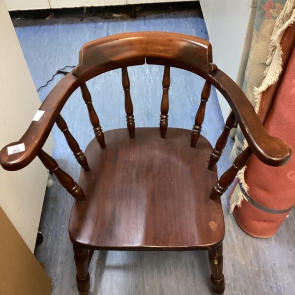 Vintage elm smoker’s bow chair with curved back and turned legs.