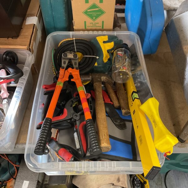 Tray of mixed hand tools including bolt croppers and hammers.