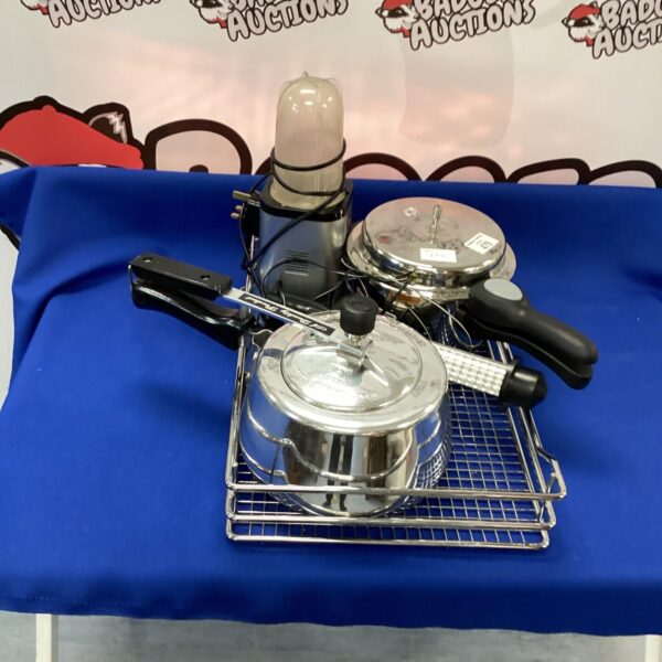 Vintage stainless steel pressure cooker for kitchen use.