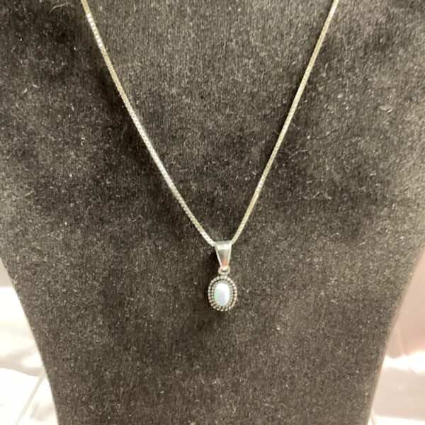 Elegant 925 silver opal pendant necklace on a silver chain.
