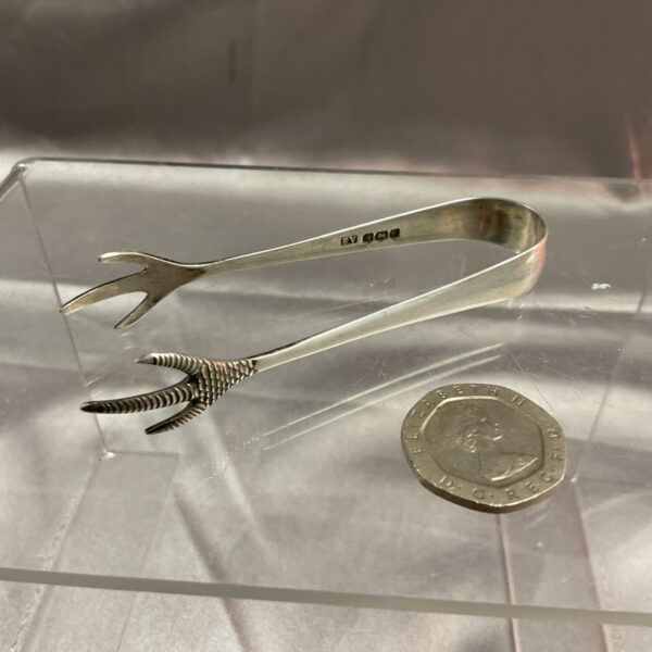 Hallmarked silver bird claw tongs, antique serving utensil.