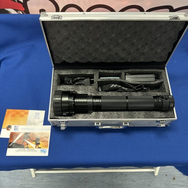 Large HID rechargeable torch in fitted carrying case.