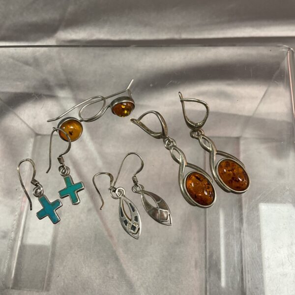 Vintage silver earrings with amber stones in a lot.