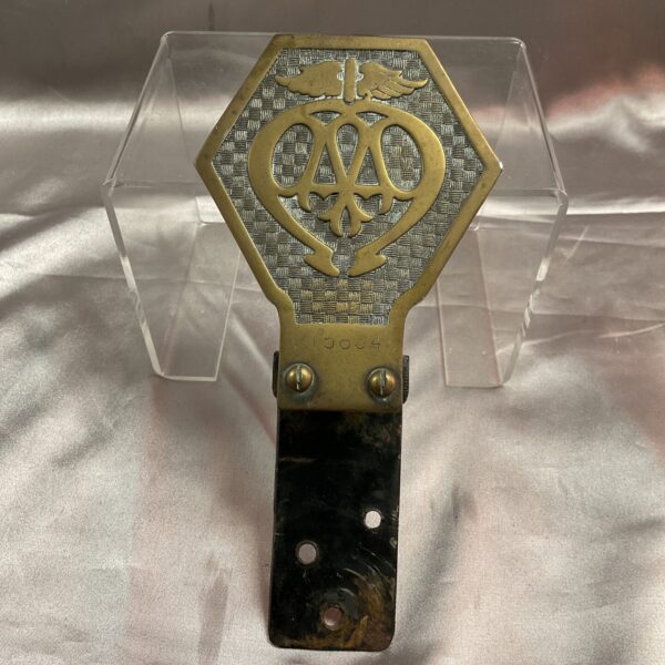 Vintage brass AA car badge, classic automotive emblem