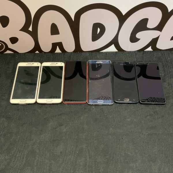 Lot of six used Samsung and Microsoft mobile phones.