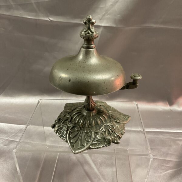 Antique Art Nouveau brass reception bell with floral details.
