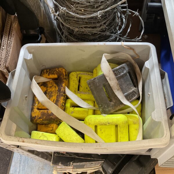 Collection of divers weights for scuba diving equipment.