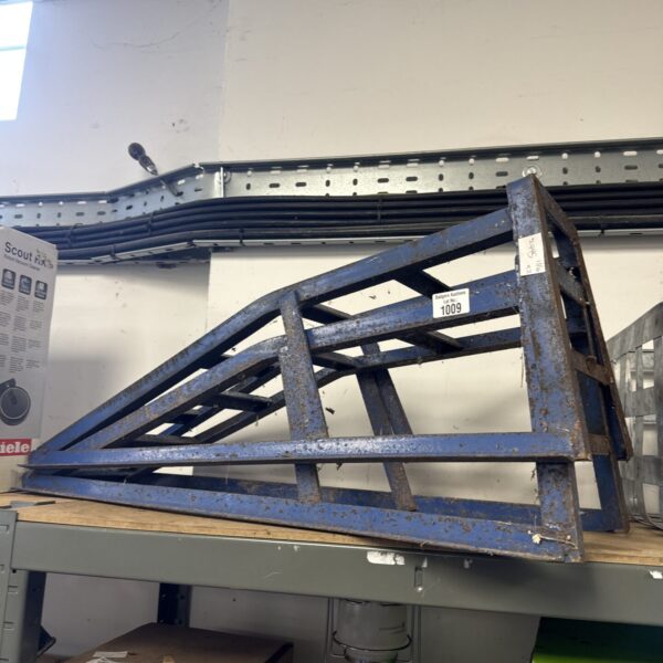 Pair of metal car service ramps for vehicle maintenance.