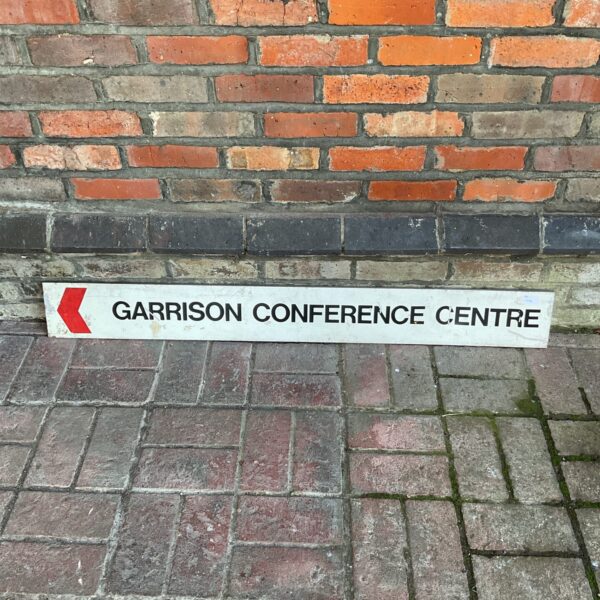 Vintage garrison conference centre sign with bold lettering.