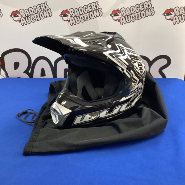 Small Wulf Sports motorcross helmet, side view.