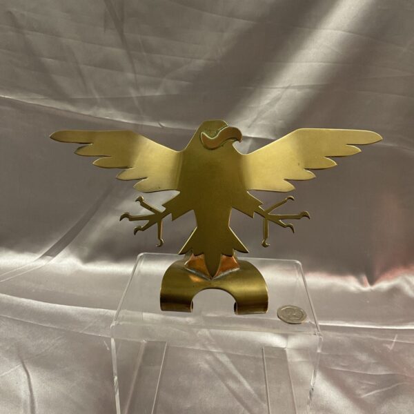 Vintage brass eagle sculpture with copper accents, dynamic pose.