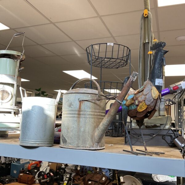 Vintage galvanised watering can with chicken ornament and planter.
