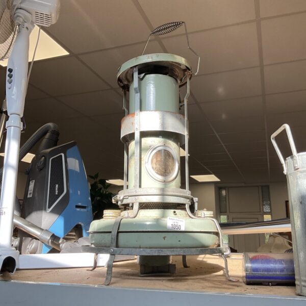 Vintage Aladdin paraffin heater for greenhouses, showing classic design.