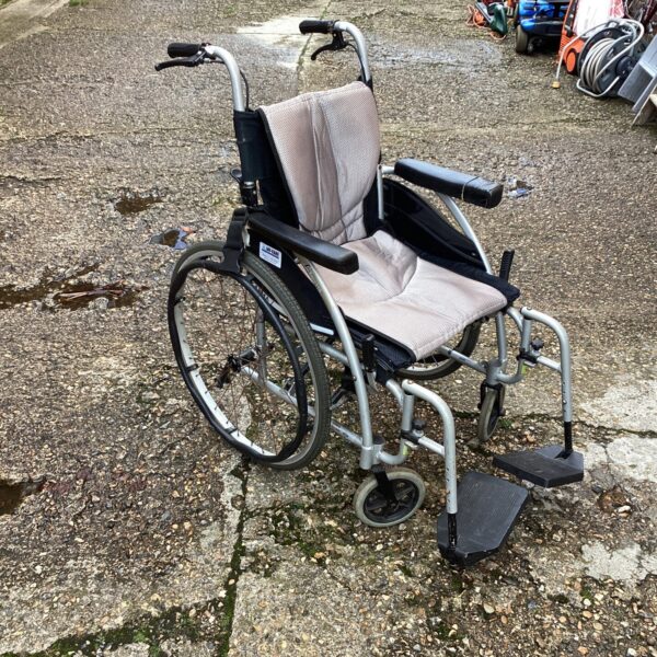 Used Ergo 115 folding wheelchair for mobility assistance.