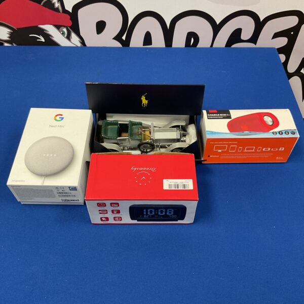 Google Nest Mini, Dreamsky alarm clock, and Ralph Lauren car model collection.