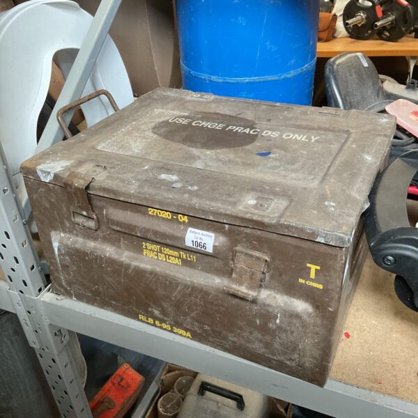 Weathered metal military ammo crate, front view.