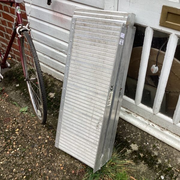 Portable aluminium mobility ramp for wheelchair access.