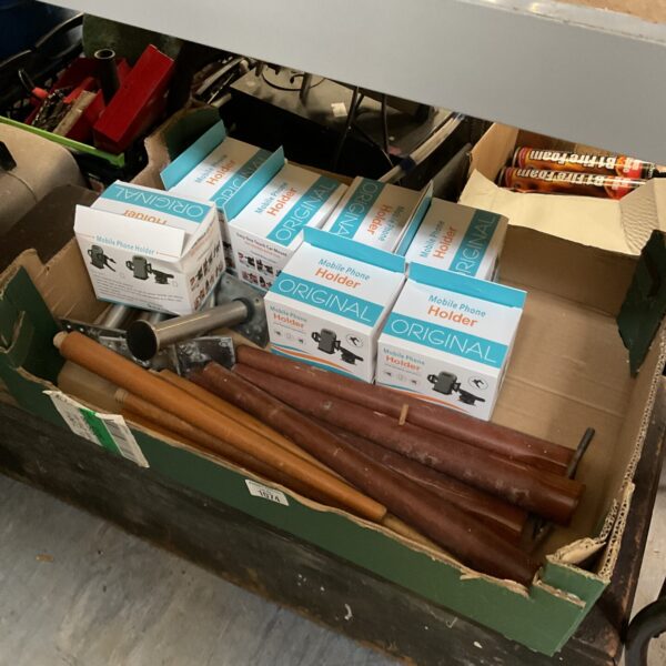 Mixed lot of vintage table legs and new mobile phone holders.