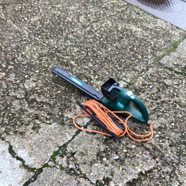 Used Wickes electric hedge trimmer for garden maintenance.