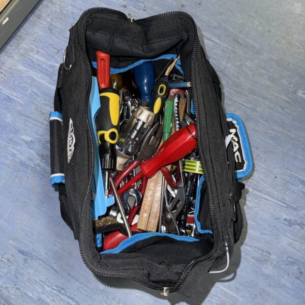 Macallister tool bag filled with various hand tools for DIY projects.