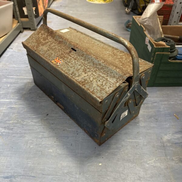 Vintage metal cantilever toolbox with open trays for tool storage.