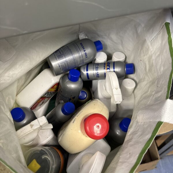 Assorted car cleaning products including polish and wax.