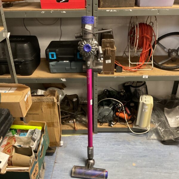 Purple Dyson V6 Absolute cordless vacuum cleaner on display.