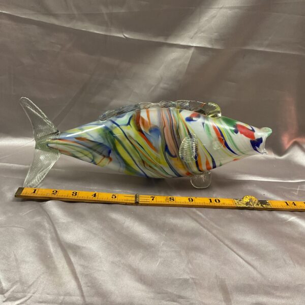 Vibrant Murano glass fish sculpture with colourful swirls.