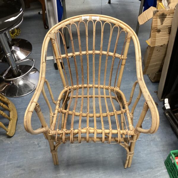 Vintage mid-century bamboo armchair with open weave design.