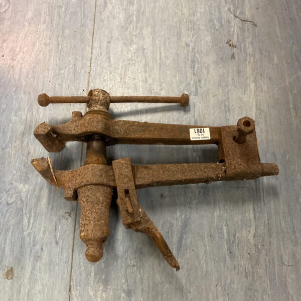 Vintage blacksmith vice with heavy cast iron jaws.