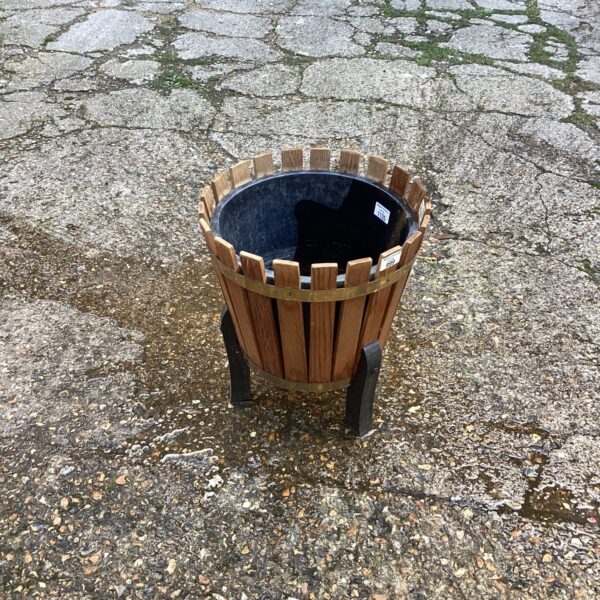 Rustic wooden garden planter for outdoor plants and garden decor.