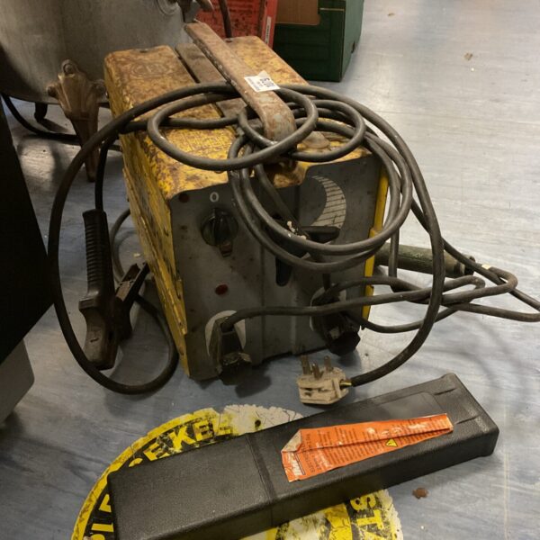 Front view of a vintage Sureweld 160m arc welder with connecting lead.