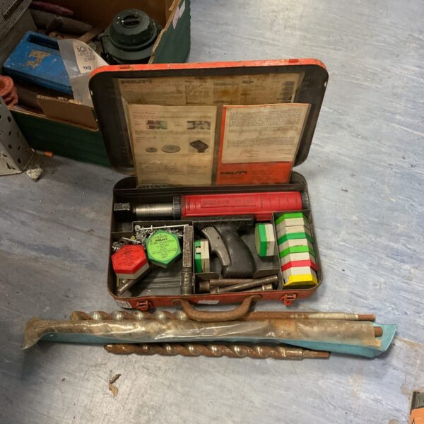 Vintage Hilti DX30 nail gun kit with drill bits in case.