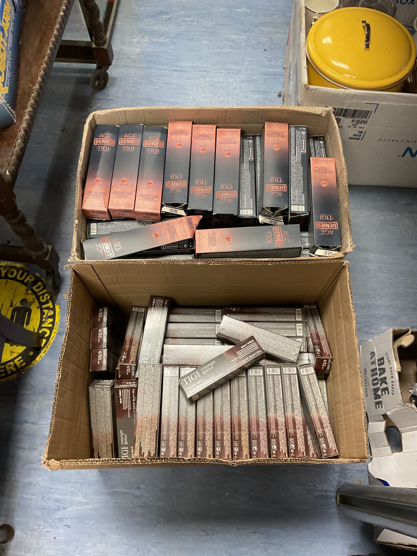 496 Two boxes full of tigi hair products inc age denied & copyright colour gloss brilliant