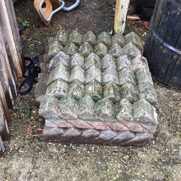 Weathered garden brickwork borders for landscape edging.
